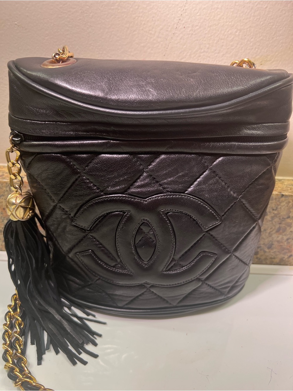 CHANEL Black Quilted Lambskin Bucket Bag with Gold Chain & Tassel